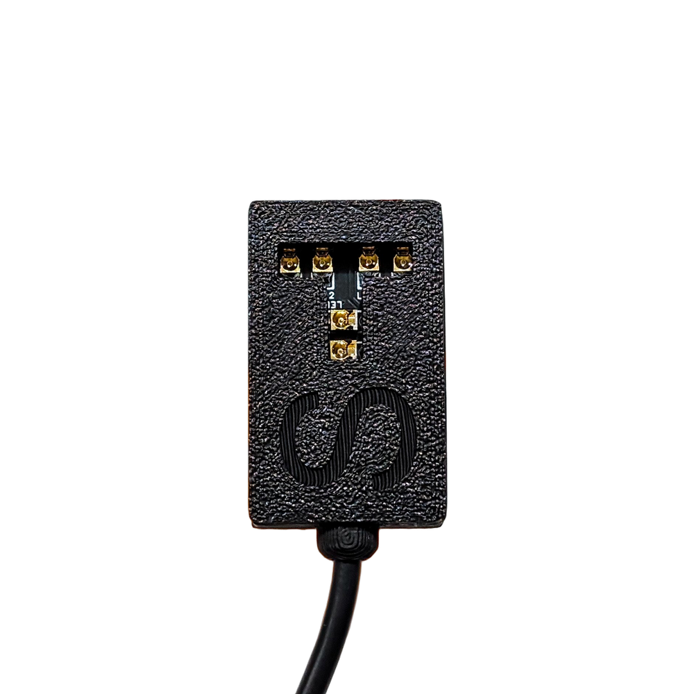 IR Stealth module - infrared for Flipper Zero on a white background - a black textured 3D-printed housing, a row of four gold contacts at the top, LED1 and LED2 markings, two more gold contacts in the middle, an embossed loop logo at the bottom and a black cable led out from the underside