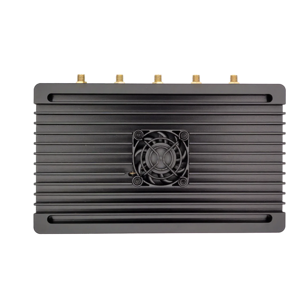 Underside of the KrakenSDR receiver with five gold-plated SMA antenna ports and a fan