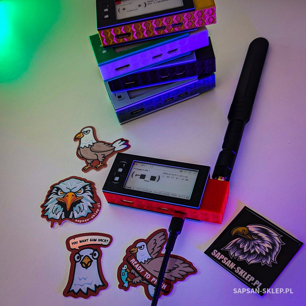 Pwnagotchi in a red case with antenna and e-ink screen, behind it a stack of colorful cases and sapsan-sklep.pl stickers
