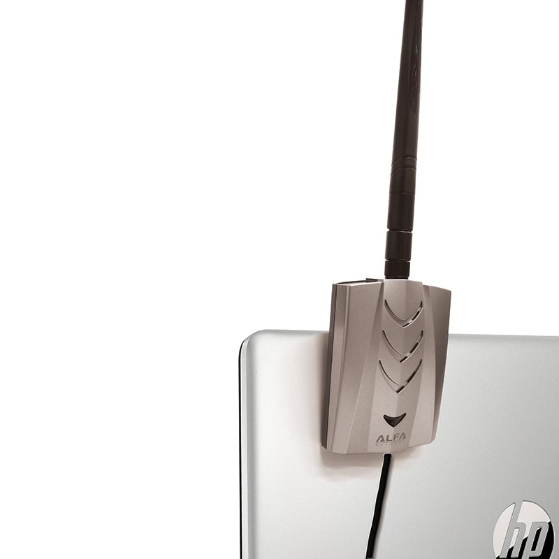 Silver and black Alfa AWUS036ACHM USB Wi-Fi adapter with antenna mounted on a clip on an HP laptop screen