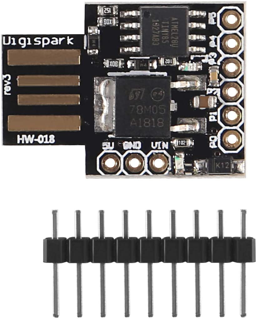Black Digispark Kickstarter board with ATtiny85 microcontroller and USB-A plug with a male gold pin header for soldering