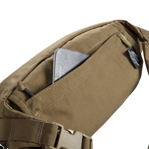 Helikon-Tex Bandicoot waist pack (coyote) from the back - the rear concealed zippered pocket with a phone inside, the Cordura/Helikon label and the strap with a buckle, on white