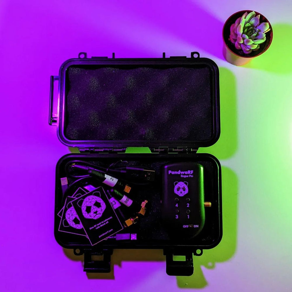 Black PandwaRF Rogue Pro RF device with a panda logo in a black case with antennas, cables and cards, in purple-green lighting