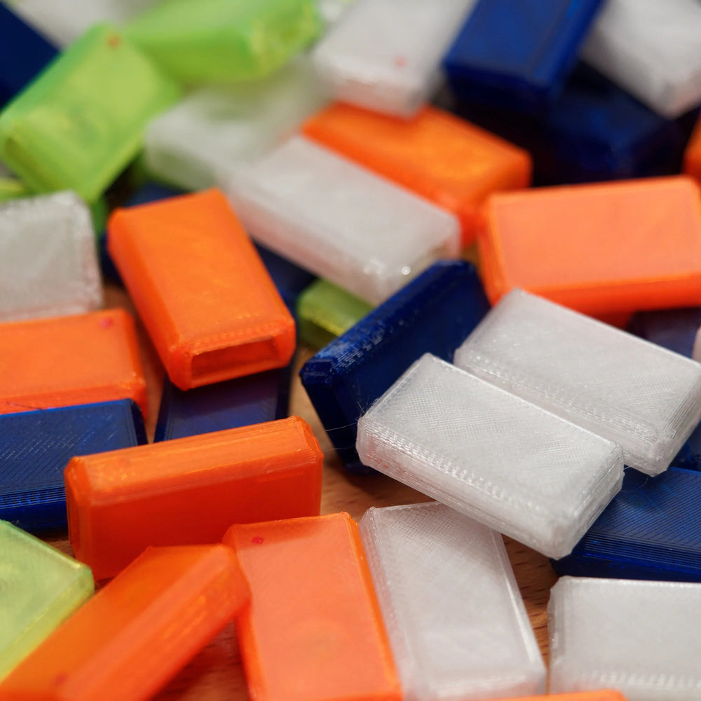 A pile of empty replacement USB Nova cases in various colours - the hollow case shells are visible
