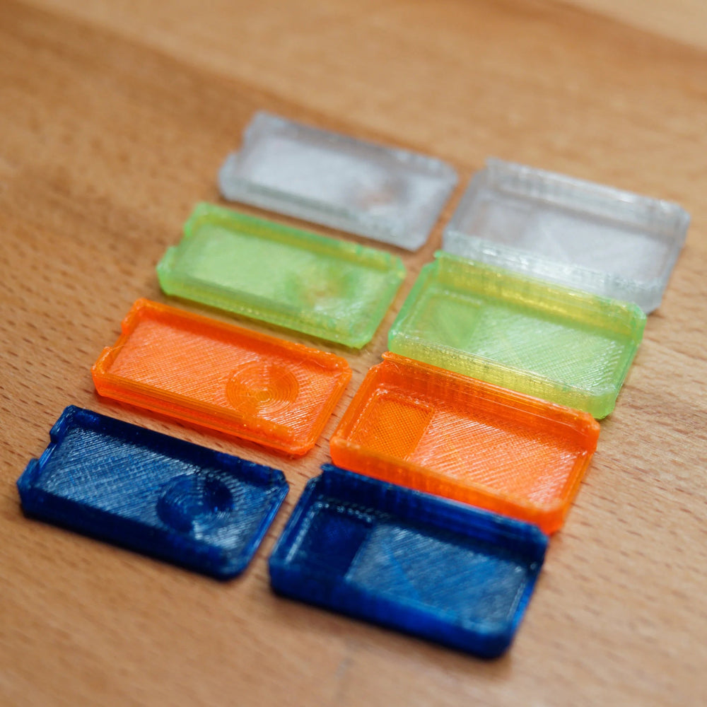 Replacement USB Nova cases split into halves - bottom and top parts in four colours