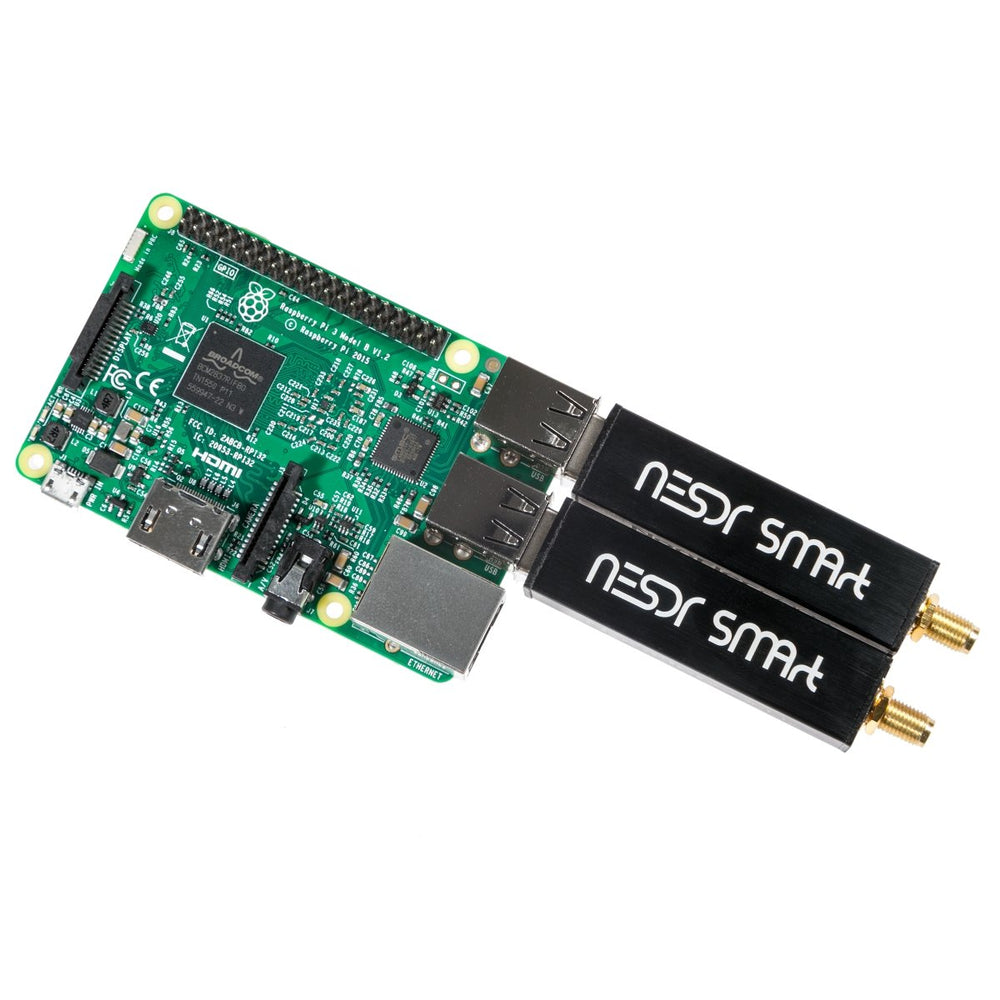 Two Nooelec NESDR SMArt v4 RTL-SDR receivers plugged into the USB ports of a Raspberry Pi 3 Model B mini computer