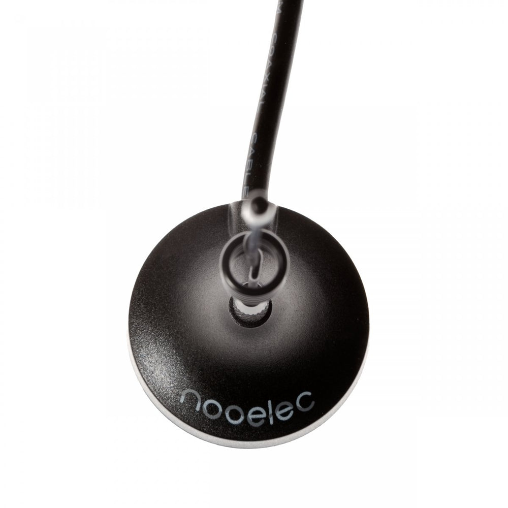 Close-up of the magnetic antenna base from the Nooelec NESDR SMArt v4 kit - black dome with the nooelec logo, SMA socket and coaxial cable