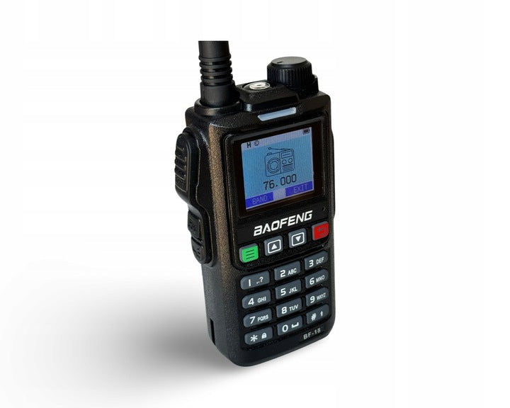 Baofeng BF-18H at an angle with a colour screen showing FM radio