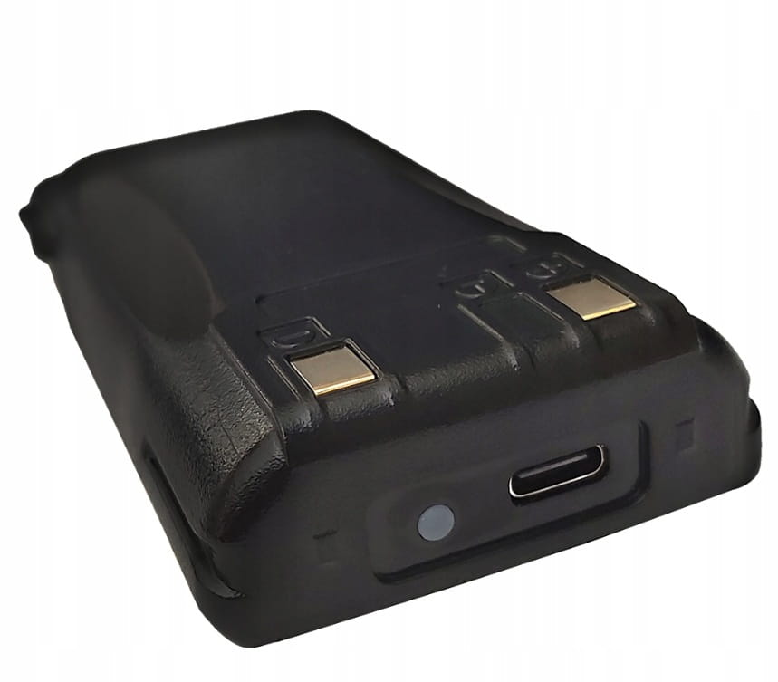 Baofeng UV-82 battery at an angle with gold contacts and a USB-C port
