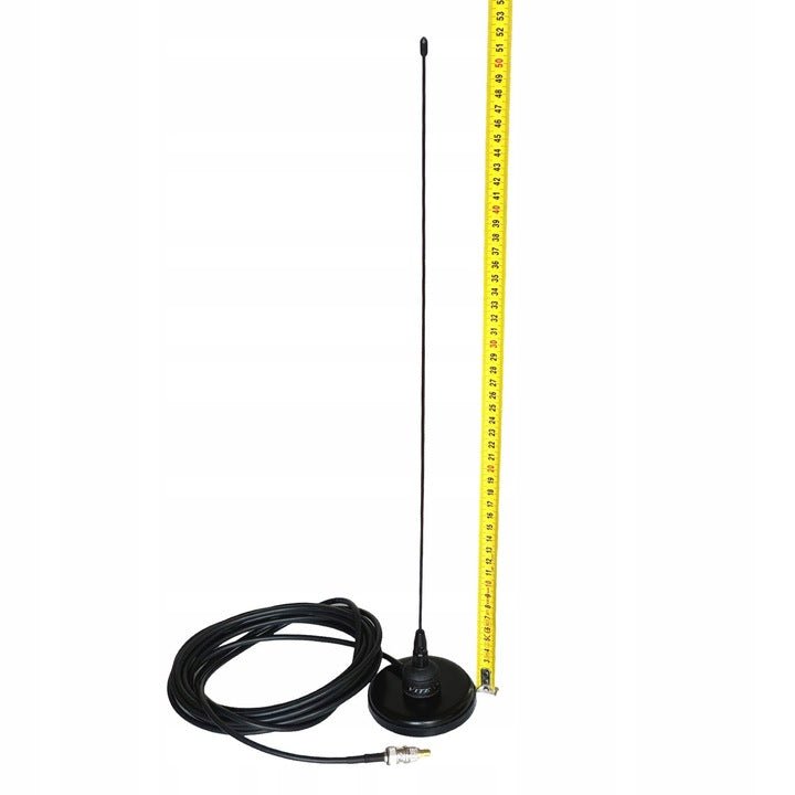 Vitex antenna on a magnetic base measured with a tape, about 50 cm long, with a coiled cable beside it
