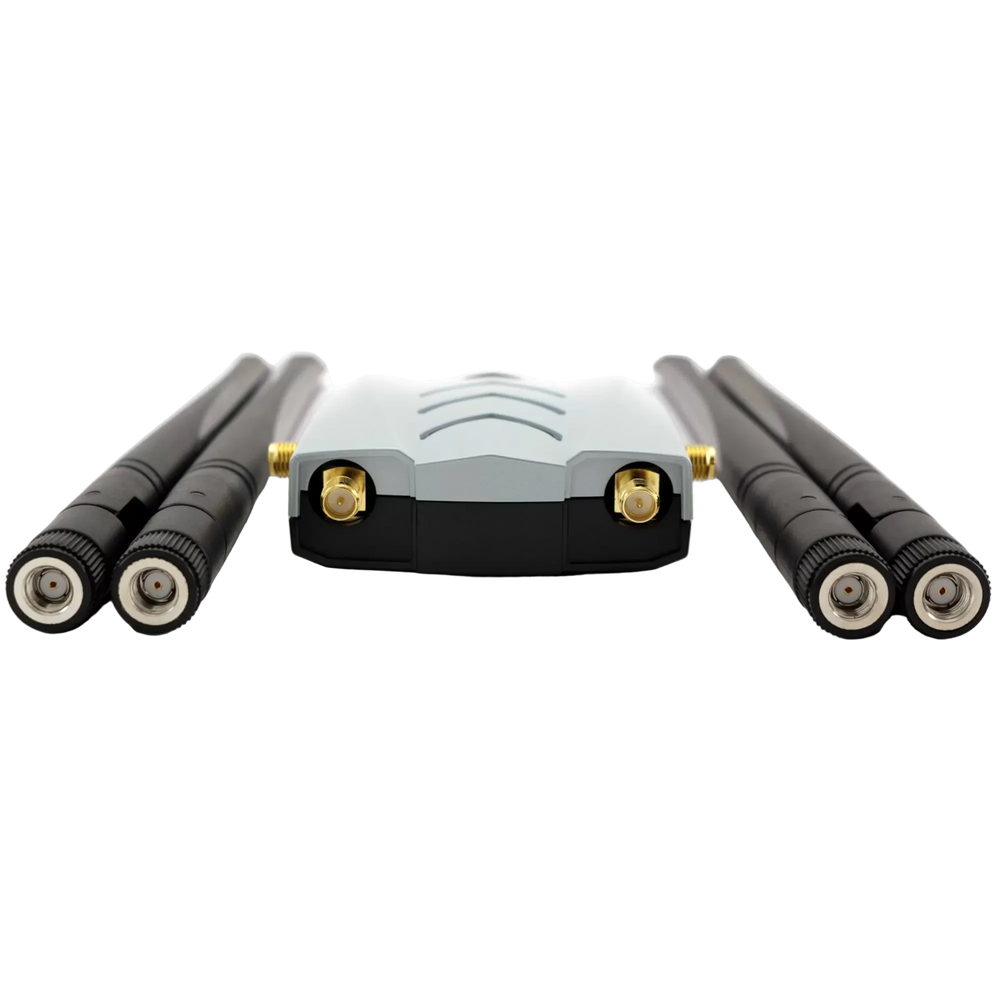 Alfa AWUS1900 USB Wi-Fi adapter with the four antennas unscrewed and gold-plated SMA connectors, on a white background