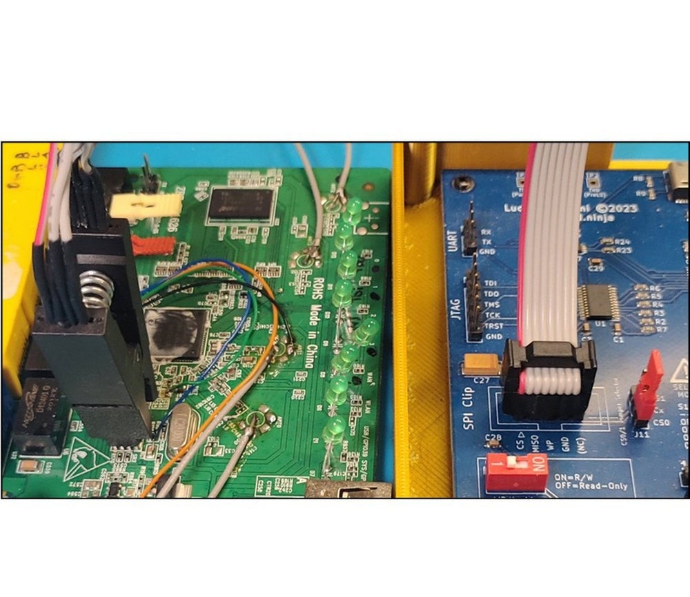 BRUSCHETTA-Board in a yellow case connected via the SPI clip and a ribbon cable to a target green board during a firmware dump