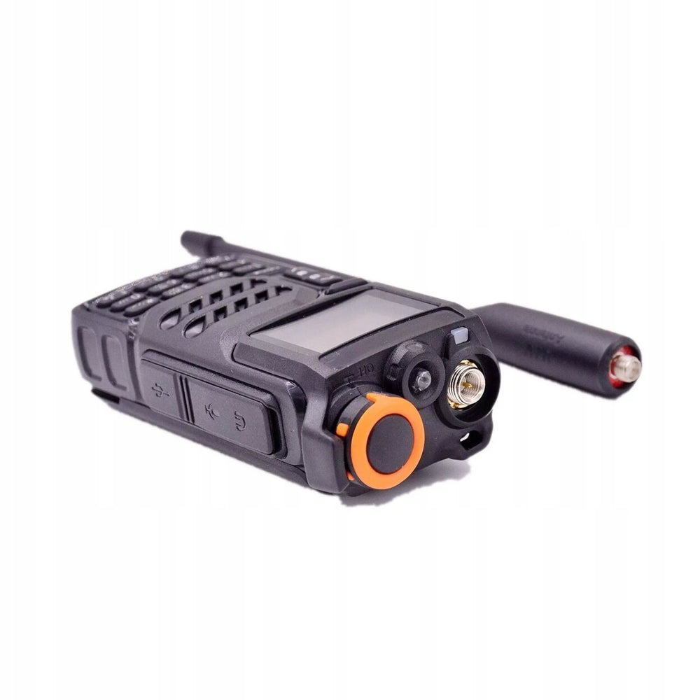 Quansheng UV-K5 from the top, SMA antenna socket, orange-tipped knob and LED flashlight