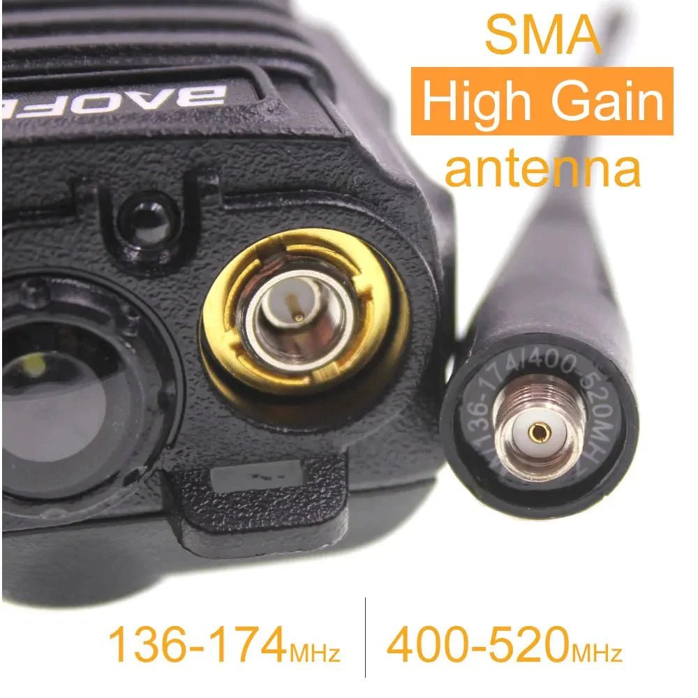 Close-up of the gold SMA antenna connector on the Baofeng UV-9R two-way radio and the detachable dual-band antenna marked 136-174 and 400-520 MHz