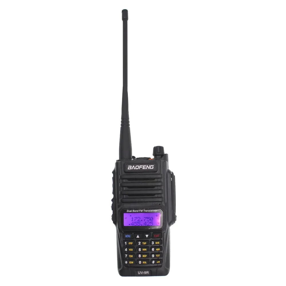 Baofeng UV-9R two-way radio from the front, black waterproof dual-band unit with an antenna and a backlit LCD display showing frequencies