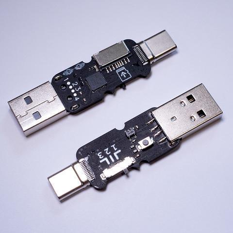 Две чёрные платы PCB MalDuino 3 с микроконтроллером, штекерами USB-A и USB-C и кнопкой, вид без корпуса
