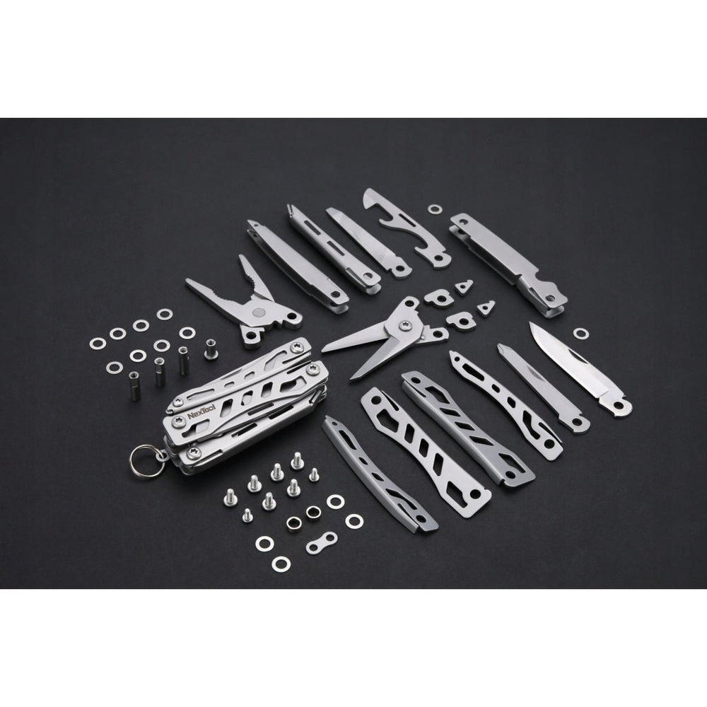 Multitool NexTool Mini Flagship rozłożony na części - wszystkie narzędzia, okładki, śruby i podkładki ułożone na ciemnym tle wokół korpusu