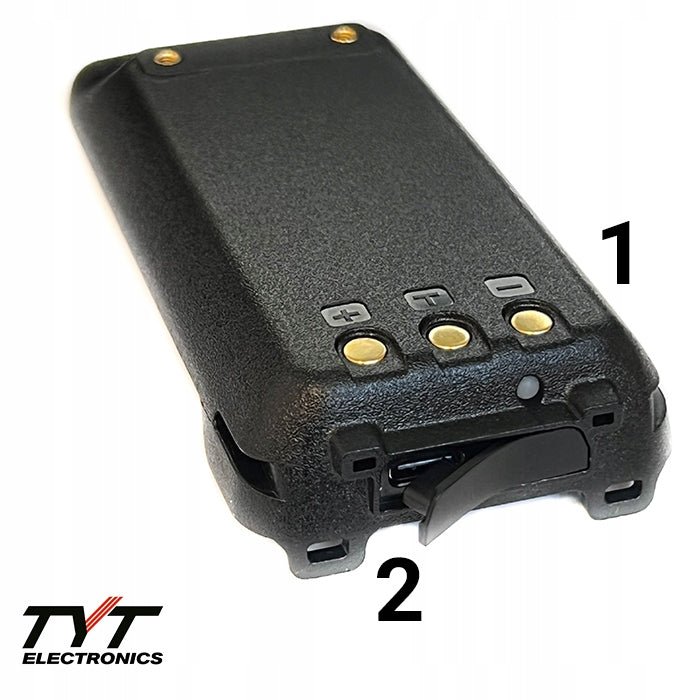 Battery pack for the TYT TH-UV98 radio - close-up of the black battery showing its gold charging contacts and the release latch, with the TYT Electronics logo, on a white background