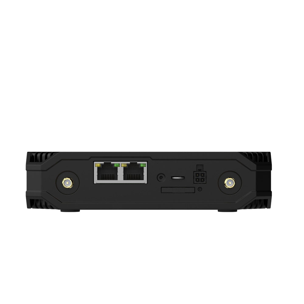 Задняя панель роутера Teltonika TCR100 с двумя портами Ethernet RJ45, кнопкой сброса, слотом SIM, разъёмом питания и двумя гнёздами антенн