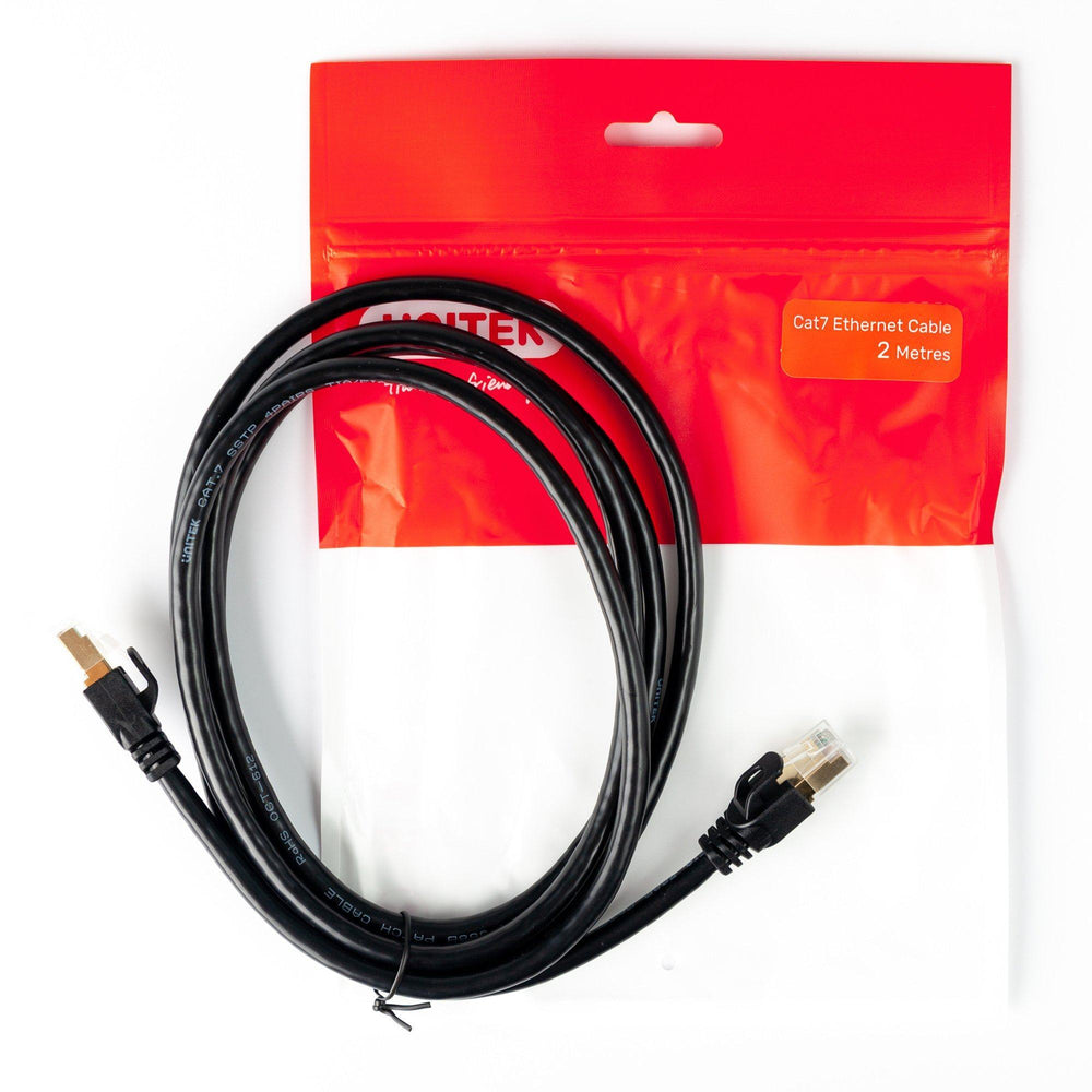 Black coiled Unitek Cat.7 5 m cable with RJ45 plugs next to red Cat7 Ethernet Cable packaging, UNITEK logo