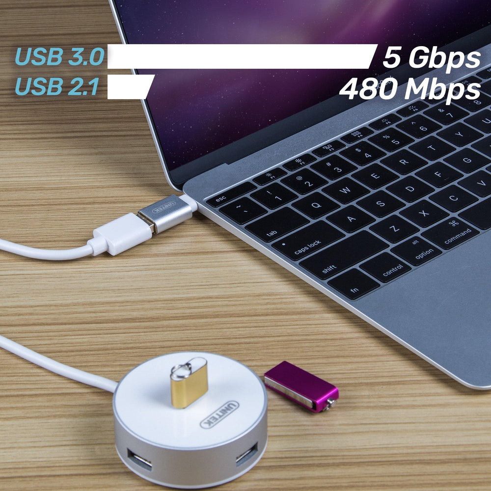 Unitek Y-A025CGY adapter connected to a MacBook with a speed comparison of USB 3.0 5 Gbps to USB 2.1 480 Mbps